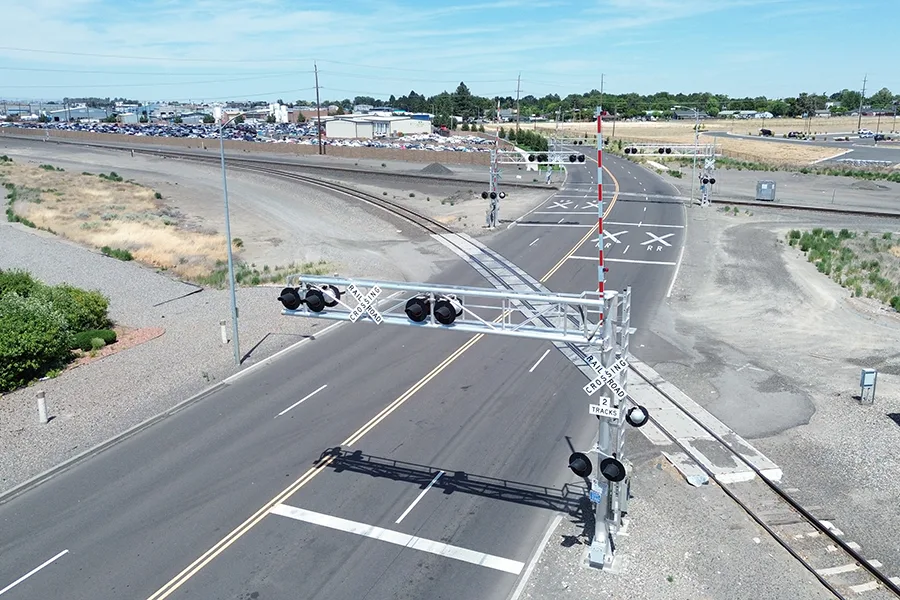An aerial shot of a railroad crossing.