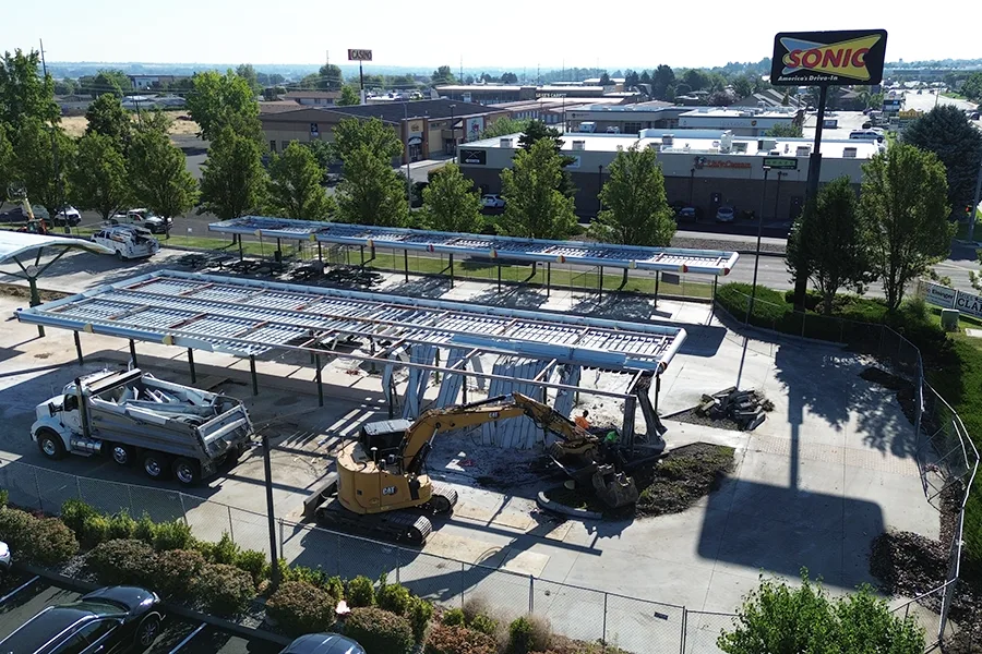 An old Sonic location being torn-down with machinery.