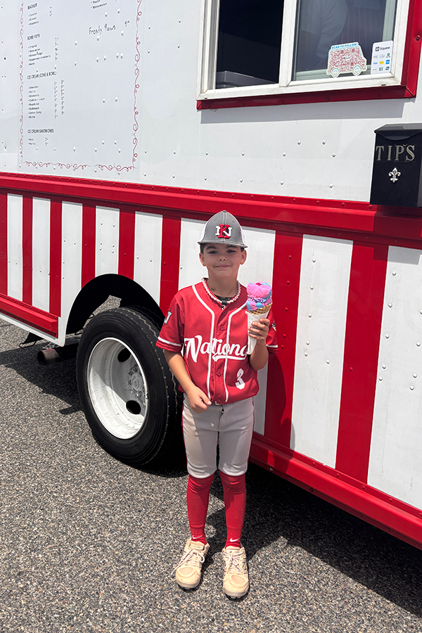 Kid holding ice cream.