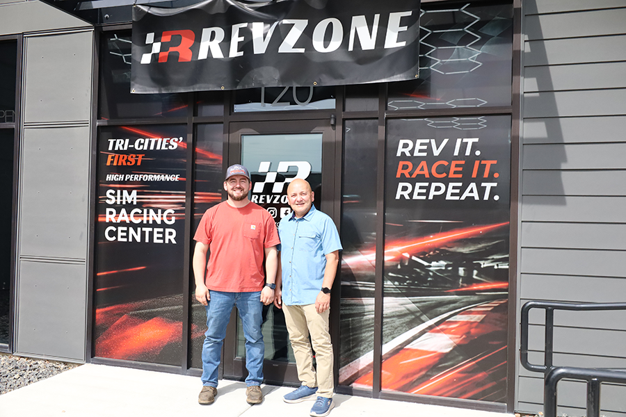 Two men outside a building.