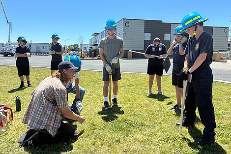 People standing around with hard hats.