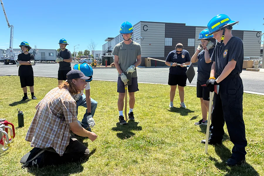 People standing around with hard hats.