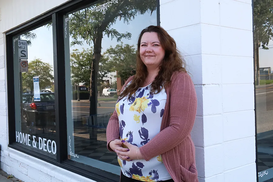 A woman standing outside a building.