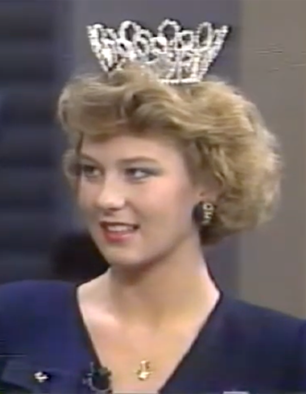 A woman with a tiara.