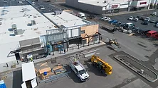 Aerial view of a corner building under construction.