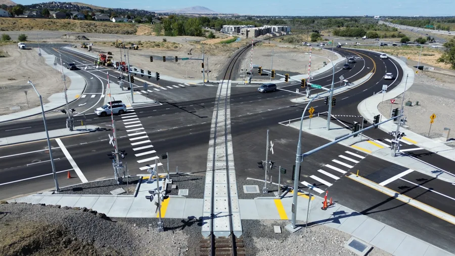 An intersection with a railroad in the middle.