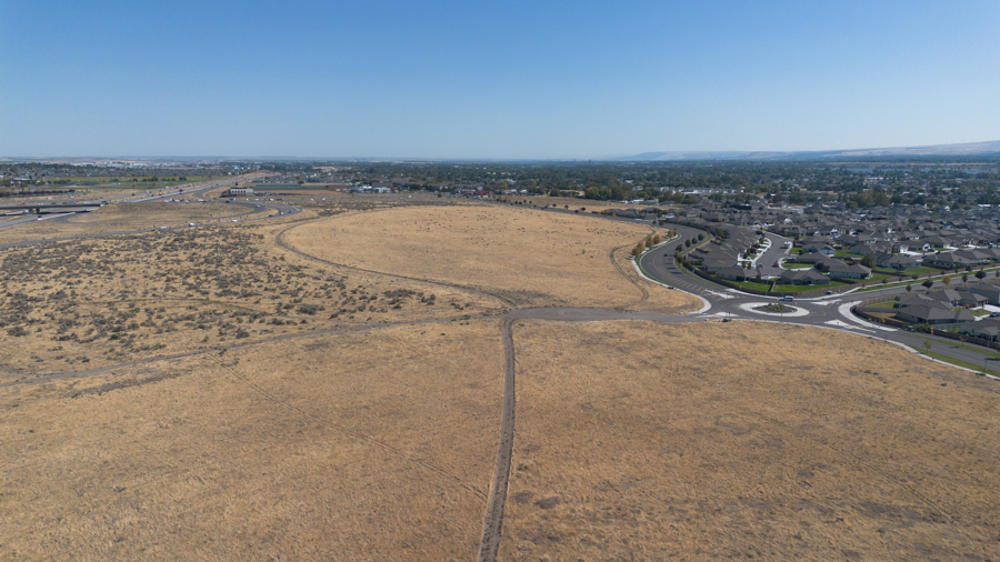 An empty field with a roundabout.