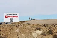 A field with a Rockwool sign.