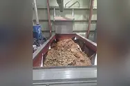 A basin filled with a brown loose material.