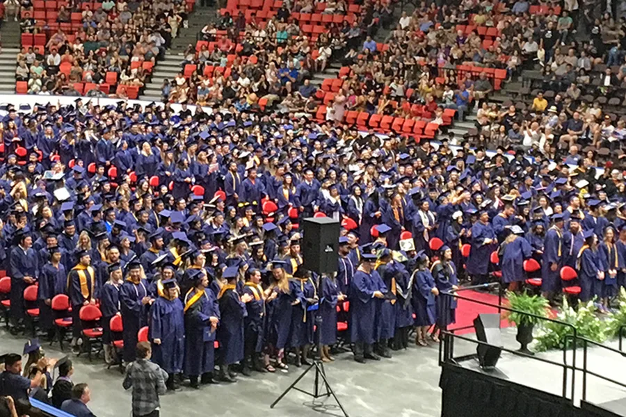 Graduates at a ceremony.