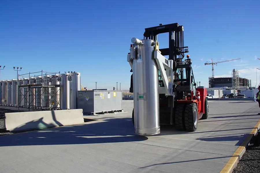 A large metal column being moved.