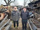 Two men in a scrap yard