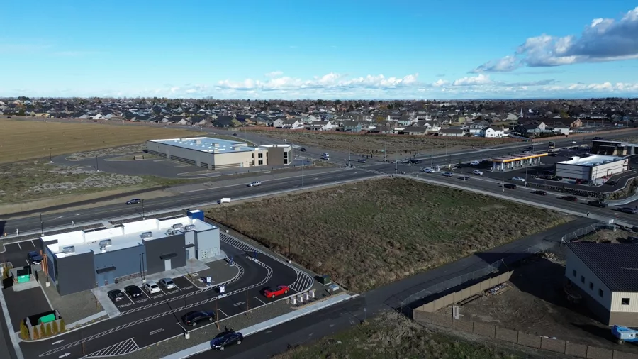 An intersection with Dutch Bros in the foreground.