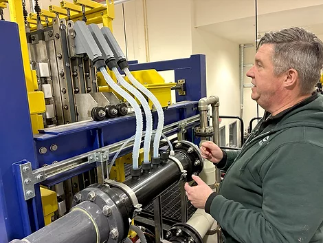 Man using a machine with tubes.