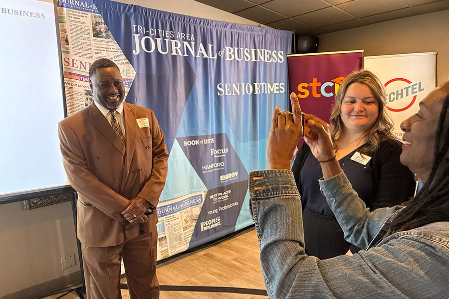 A winner getting their picture taken.