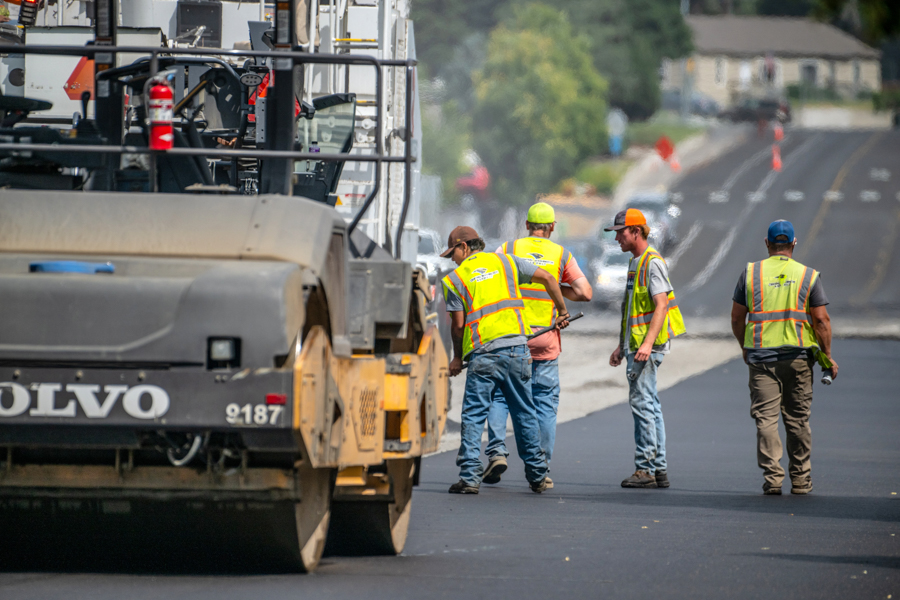 Workers and a steamroller.