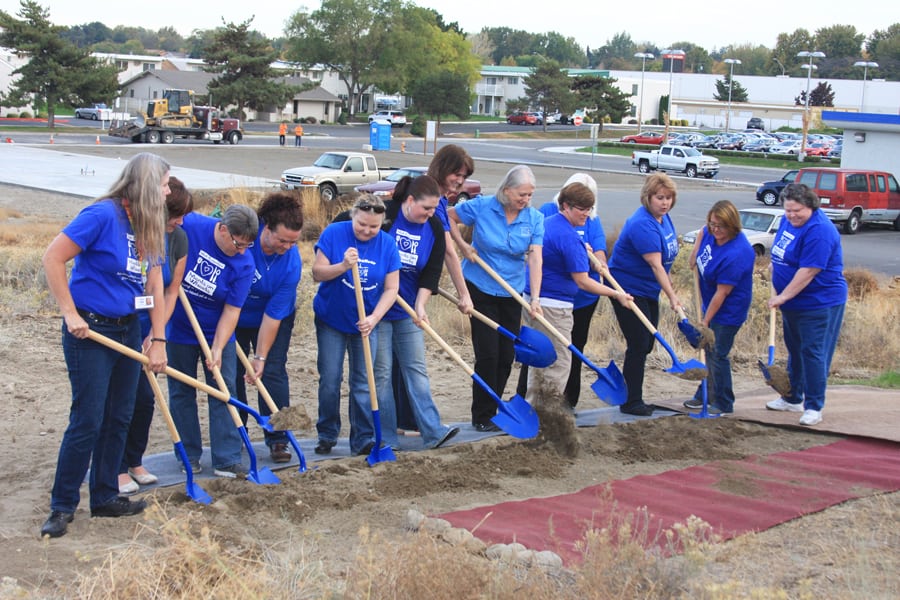 Photo of Meals on Wheels staff helping break ground on a new kitchen.