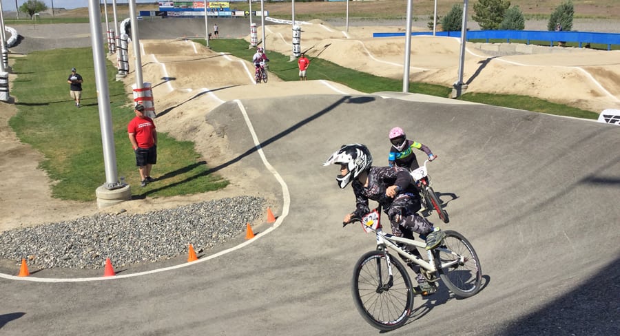 Local BMX riders take a turn at the Columbia Basin BMX track recently in Richland. The track has seen an improvement in facilities, a rise in membership, and the track has hoist to national events in 2014 and 2015. The track is bidding to host a 2017 national event.