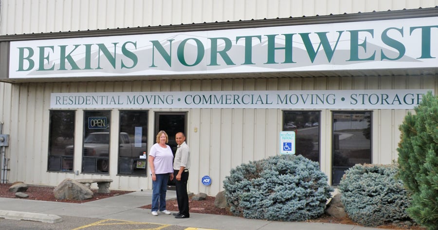 Isidoro "Izzy" Almaraz, general manager, and Dianna Steele, branch accountant, stand in front of the new Bekins Northwest facility at 1100 Columbia Park Trail in Richland. The moving and storage facility moved its offices from Pasco to Richland in June after buying Clancy's Transfer & Storage.