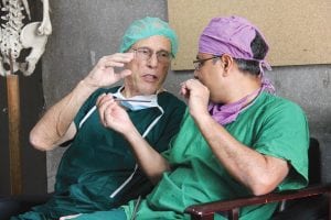 Dr. Zamen, right, a young surgeon from Dhaka, Bangladesh, talks with Dr. Lewis Zirkle during his recent visit to Bagladesh.
