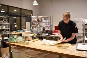 Ethos Bakery and Café baker Jennifer Campbell makes pastries at the restaurant’s new location.