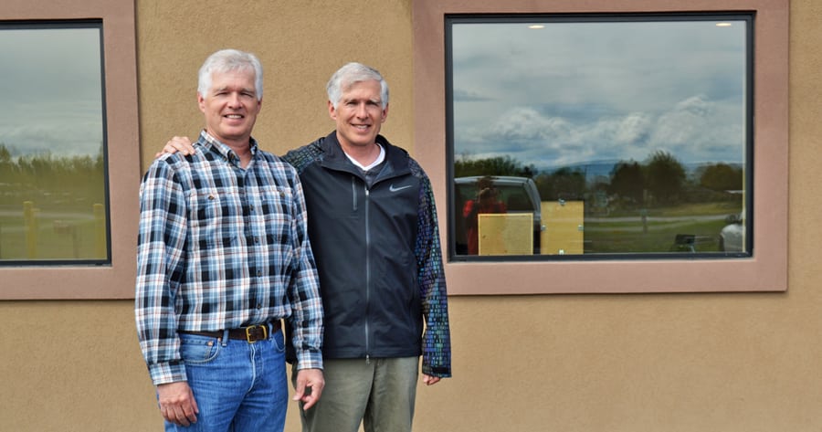 David, left and Nathan Croskrey stand outside their recently completed Road 44 storage unit project in Pasco. The identical twins have bought, built and sold dozens of properties across the Tri-Cities.