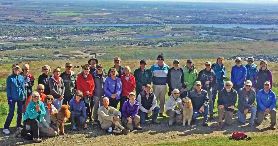 Thirty-two members of the Fun, Fit & Over Fifty Club pose for a photo after a recent hike up Badger Mountain. The club, which started in 2003, has monthly outings to members that include walks, hikes, bike rides and water and camping excursions, as well as social and intellectual activities. The club boasts 350 members who pay annual dues of $15.