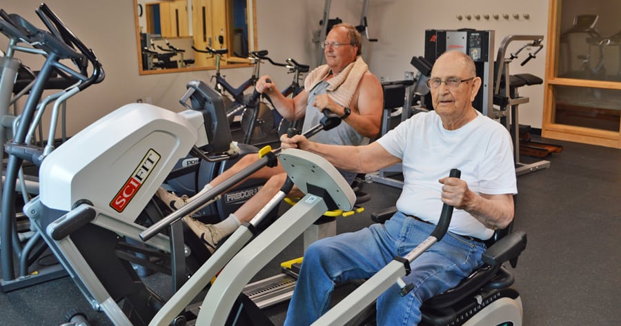 Cloyd Bowers, 93, right, and Dave Car, 61, use the seated steppers at the city of Richland’s new gym COR Fit at the Richland Community Center.