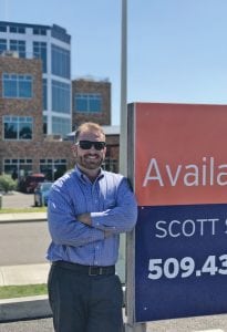 SVN Retter & Company’s Scott Sautell stands in front of one of his current listings. The $8.9 million investment property is at 1446 Spaulding Ave. in Richland.