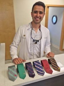 Dr. Antonio Lopez-Ibarra, a Kennewick dentist, shows off some of the neckties he and his nephew design and sell. He and Noel Lopez own Town+Co, which sells ties showcasing different nations’ and states’ icons.