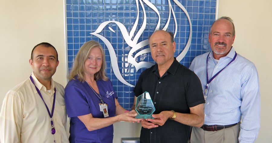 Chaplaincy Health Care’s efforts to provide hospice care to the Hispanic community are paying off with year-over-year growth. Chaplain Alberto Tass, from left, senior nurse case manager Anita Mundy, Chaplain Victor Ortega and Executive Director Gary Castillo show off the Latino Health Care Professional of the Year award they received from the Hispanic Chamber of Commerce for their outreach efforts.