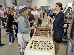 Double Canyon Winery poured samples of its award-winning wines for guests attending the Sept. 13 open house at the new West Richland facility.