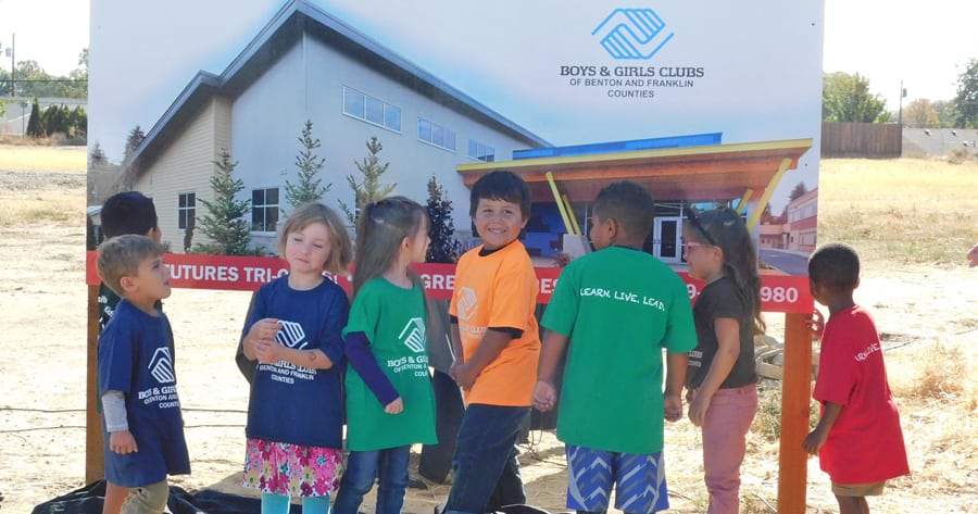 Kids from the Boys and Girls Clubs of Benton and Franklin Counties stand at the site of the future $4.3 million clubhouse off South Jean Place in Kennewick. (Courtesy Boys and Girls Clubs of Benton and Franklin Counties)