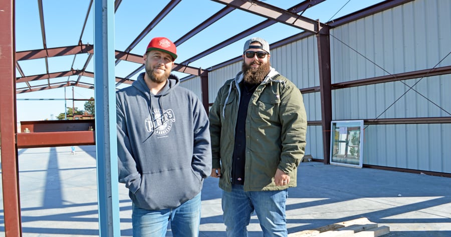 Brothers Reed, left, and Porter Kinney of Porter’s Real Barbecue restaurant stand outside the Temple of ’Cue that’s under construction in Richland. The new kitchen will be able to smoke 3,000 pounds of meat daily to supply their Richland restaurant and the one they plan to open next spring in Kennewick.