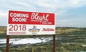 A sign for the new Bleyhl Co-op store is located south of Interstate 182 and across from Maverik.