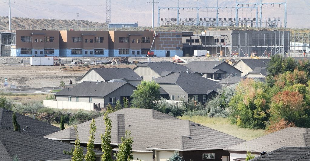 Homes and schools are being built to fill the demand of the growing population in the Tri-Cities. These homes and Kennewick elementary school No. 16 are being built in south Richland. (Photo: Paul T. Erickson)