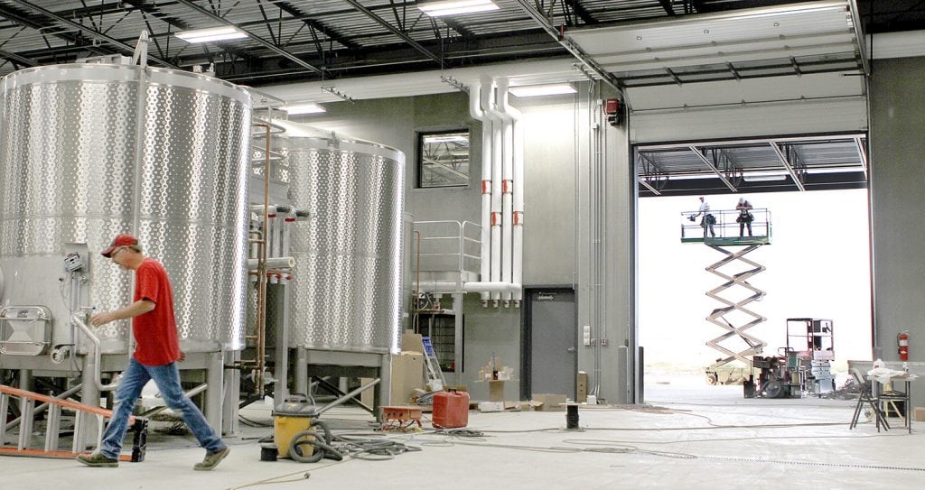 A flurry of activity continues during construction at Double Canyon Winery in West Richland. The 47,000-square-foot winemaking facility opened in September. The $6 million facility has the capacity to make 50,000 cases of wine. (Photo: Paul T. Erickson)