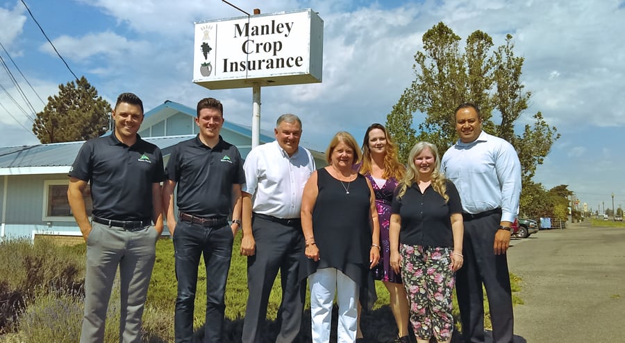 Justin Toner, from left, Josh Toner, Brad Toner, Ann Manley, Brooke Manley Rodriguez, Tina Randles and Laauli Faamausili stand in front of Manley Crop Insurance, which was acquired by Basin Pacific Insurance & Benefits in May. The Prosser office will keep its location and name. 