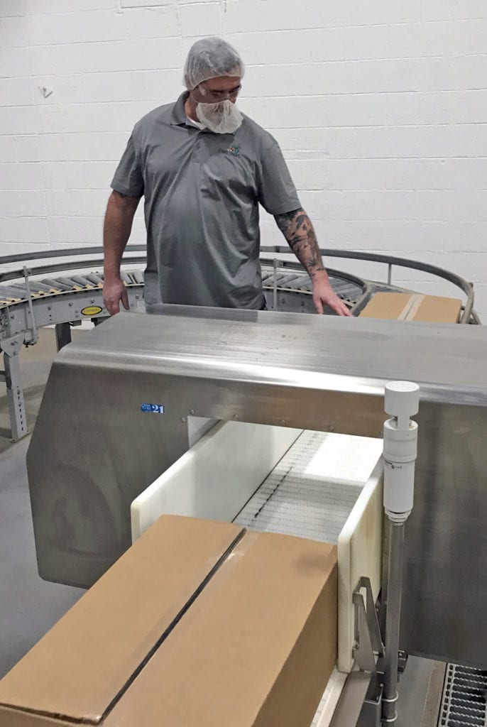 Jeremiah Johnson, FruitSmart’s dry production supervisor, works the packaging line at the company’s Prosser warehouse. FruitSmart recently added dry production to its Prosser facility. Previously, the building was used solely for dry and frozen product storage.
