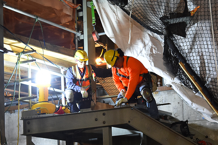 Ironworkers install stairs at the vit plant’s Effluent Management Facility. (Courtesy Bechtel National Inc.)