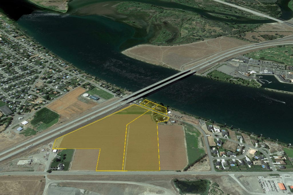 The Kennewick home builders who bought the 39-acre Harris Farm on the Columbia River in Pasco will build 500 to 600 townhomes and condominiums on the property. A separate buyer purchased two waterfront homes but has no immediate development plans. (Courtesy Musser Bros. Auctions)