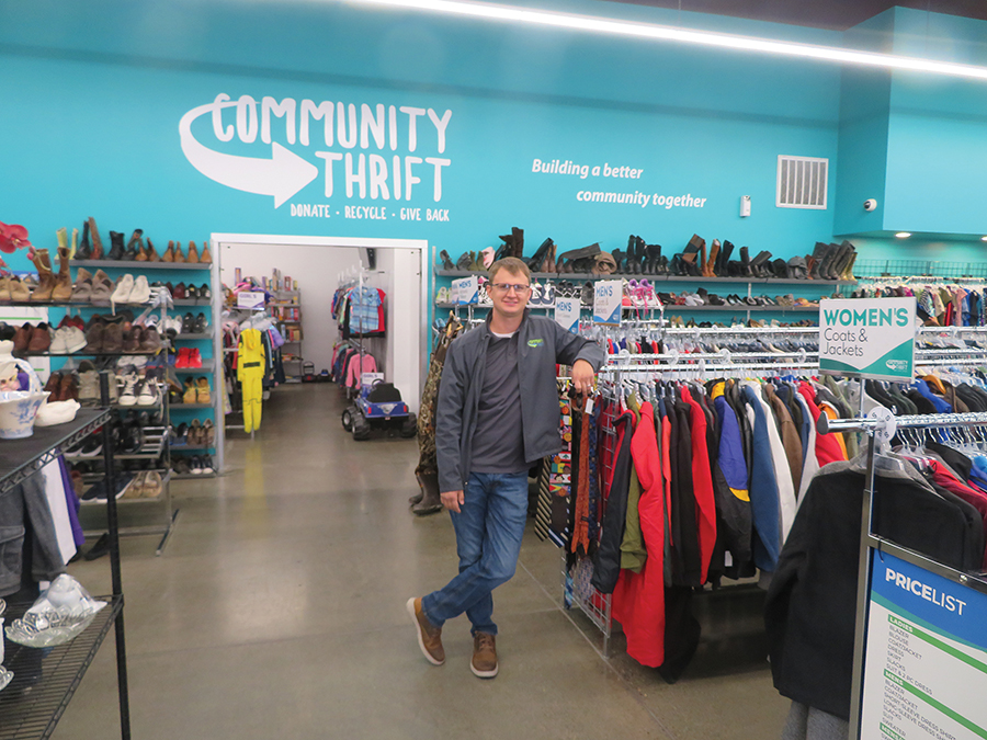 Owner Dustin Stordahl stands inside the recently expanded Community Thrift store at 303 Wellsian Way in Richland. He was able to move his production and pricing area into a vacant shop of the building so he could expand the store’s children and toy area. (Photo by Kristina Lord)