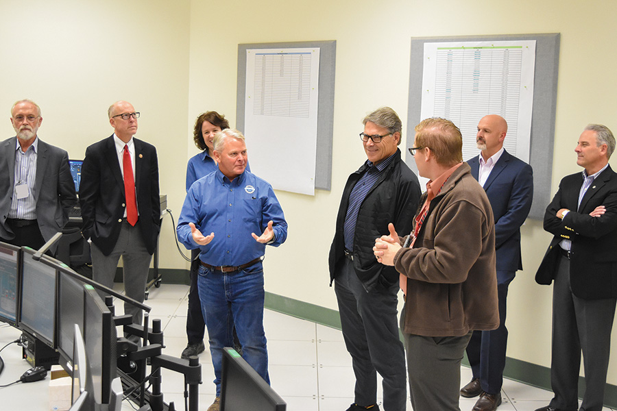 U.S. Rep. Dan Newhouse, R-Sunnyside, left, invited Jennifer Granholm, the new Energy secretary, to tour the Hanford site, continuing his tradition of hosting senior officials in Richland. Above, he welcomed former secretary Rick Perry, center in dark jacket, in August 2017. Perry was former President Donald Trump’s first Energy secretary. (Courtesy Bechtel National Inc.)