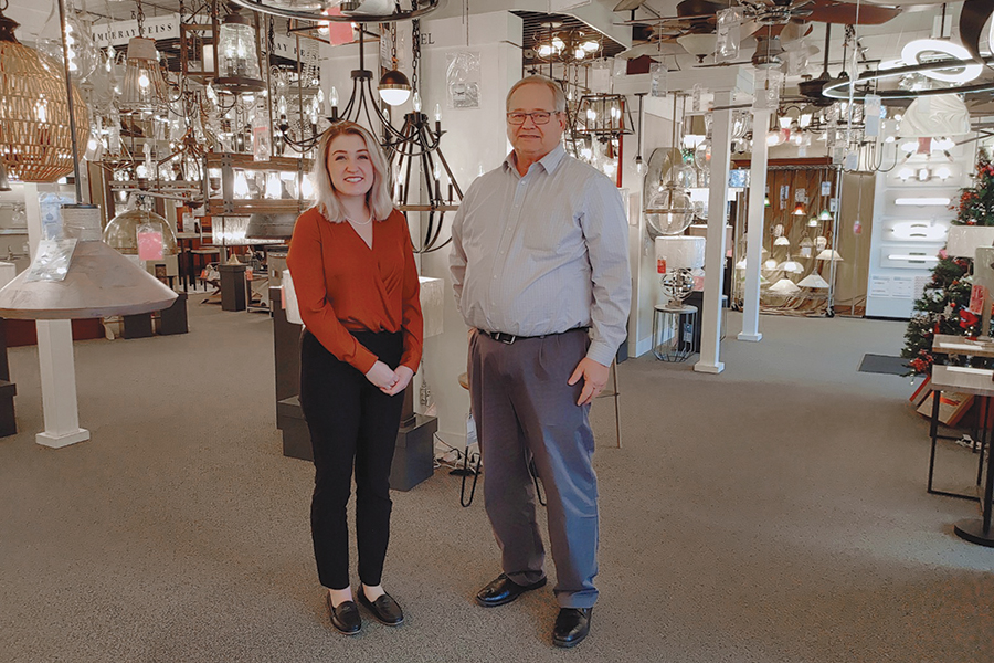 Amelia Kittson and her father Gus Kittson stand inside KIE Supply Corp., which started in downtown Kennewick in 1955. It has expanded over the years to carry irrigation, plumbing, electrical, decorative lighting, bathroom fixtures and appliances. Amelia works alongside her dad to prepare for her future role as the next-generation leader of the company. (Photo by Wendy Culverwell)