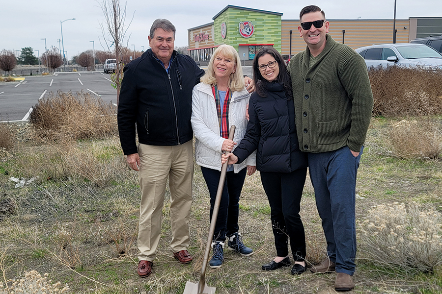 Chris Corbin, far right, stands with his family, from left, parents John and Kathy and wife Jennifer Corbin, at the site of his $3.5 million development at 6481 W. Skagit Ave. in Kennewick, adjacent to Chuck E. Cheese, where he plans to welcome dozens of food trucks in one location. (Courtesy Chris Corbin)