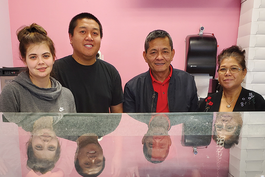 Caitlin Tucker, from left, and her husband Steven Bun, John Peck and his wife Samath Bun are the skilled hands behind the sweet treats at Popular Donuts, 101 N. Union St. in Kennewick where the doughnut shop has been in business since 2005. (Photo by Laura Kostad)