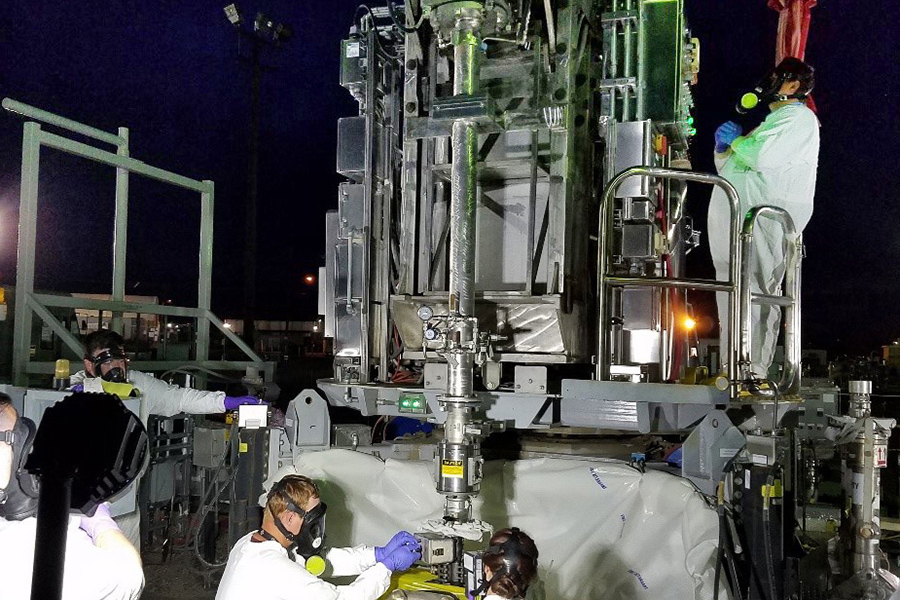  Working at night to avoid heat stress during record-breaking heat on the Hanford site, Washington River Protection Solutions workers sample waste inside a tank to develop corrosion control strategies that will prolong the life of that tank. (Courtesy WRPS) 