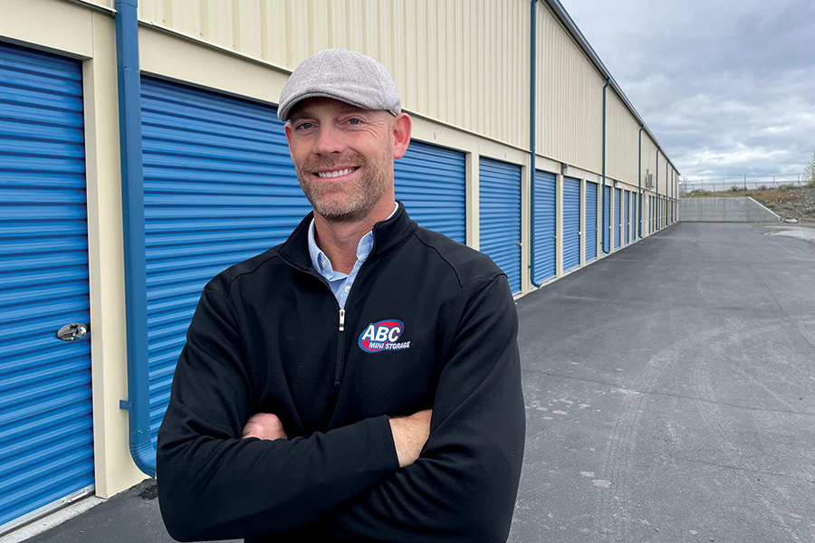 Ryan Daley, president of ABC Mini Storage, stands in front of his self-storage business on 701 Aaron Drive in Richland. Construction is underway on his second Tri-City storage store on Wellsian Way in Richland. Record occupancy and a rosy outlook for the industry nationwide have prompted several prominent Tri-City developers to build more mini storage. (Photo by Kristina Lord)
