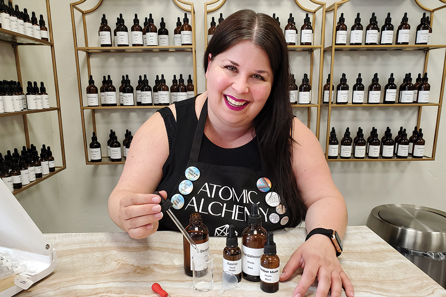 Shannon Franklin, owner of Atomic Alchemy, helps clients create custom signature fragrances made from pure ingredients at her shop at 226 Williams Blvd. in Richland’s Uptown Shopping Center. (Photo by Laura Kostad)