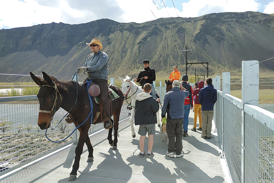 Horseback riders, pedestrians and a dog cross the Columbia River on the newly opened Beverly Bridge, which carries the Palouse to Cascades State Trail between eastern and western Washington near Vantage, Washington. Gov. Jay Inslee and a crowd of some 300 dedicated the bridge on April 8. (Photo by Wendy Culverwell)